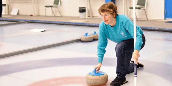 Reflector hurries hard during Curling Bonspiel